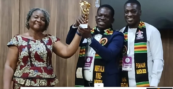 Murtala Kwei-Nortey Inusah (M) expressed heartfelt gratitude to IPLS for the award