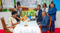 Officials from Uganda (L) and Tanzania (R)  signing a bilateral deal on November 9, 2023
