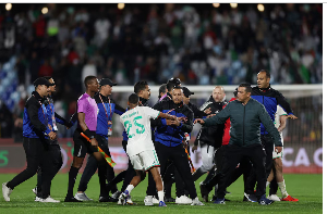 Algeria's Rafik Belghali clashes with match officials after the match