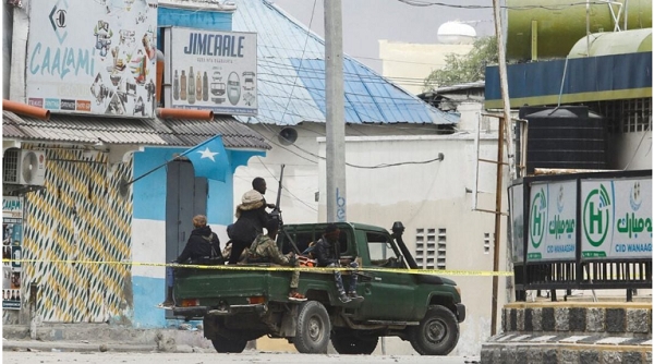 Somali security officers are seen patrolling the streets in Mogadishu, Somalia