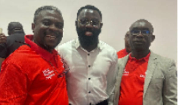 Kofas (middle) in a pose with some officials