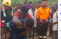 The accident victim strapped at the back of one of the fire fighters