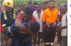 The accident victim strapped at the back of one of the fire fighters