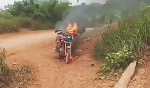 Watch as galamseyer curses soldiers after they set his motorbike ablaze