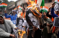 Activists of right-wing Hindu groups burn portraits of Pakistan's Prime Minster Anwaar-ul-Haq Kakar