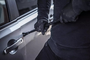 File photo of a man trying to break into a car File photo of a man trying to break into a car