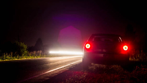File photo of  a car parked on the roadside in darkness
