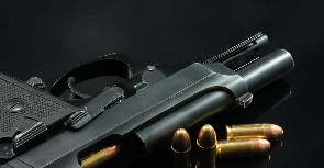 File photo of a gun and bullets