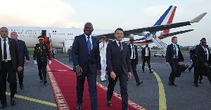 Emmanuel Macron, (R), is greeted by Prez Brice Oligui Nguema upon his arrival in Gabon, Nov 2025