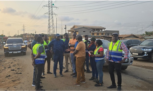 The Minister of Roads with some technocrats in the field