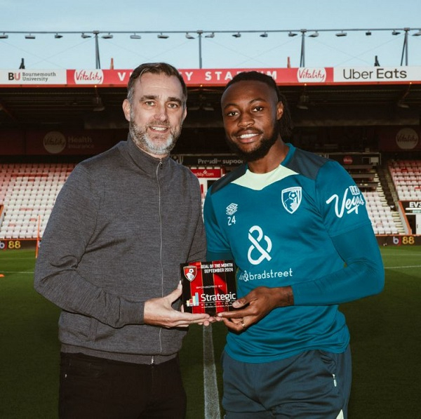 Antoine Semenyo (left) holding his Goal of the Month award