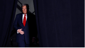 President-elect Donald Trump takes the stage during a campaign rally at Macomb Community College