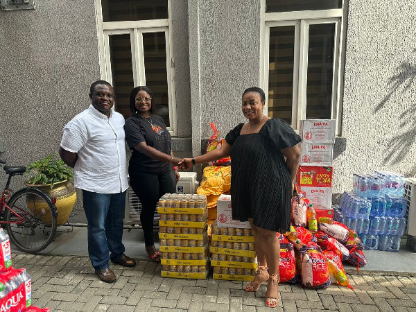 Hon. Sam George and his spouse, Vera George presenting the items