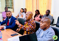 Edmund Agboh (M) giving directives at the meeting