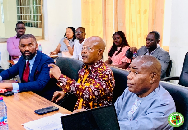 Edmund Agboh (M) giving directives at the meeting