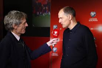 England manager Thomas Tuchel (L) was interviewed by a journalist after a game