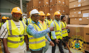 Health Minister Mintah Akandoh (far right in helmet) with some officials