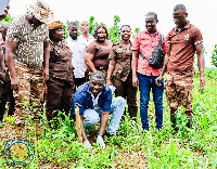 Frank Annoh-Dompreh planting a tree on Green Ghana Day