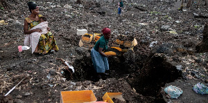 Kahindo, displaced by fighting, collects volcanic gravel for sale at an emptied IDP camp in Mugunga