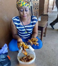 Gifty Addo displaying the animal intestines in which the parcels of 
