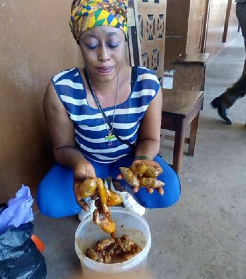 Gifty Addo displaying the animal intestines in which the parcels of 