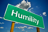 File photo of a signpost showing humility