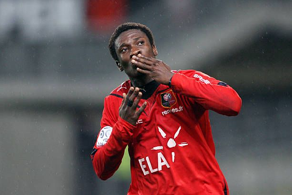 Asamoah Gyan celebrating after scoring a goal