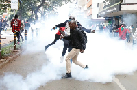 Police use tear gas to disperse protesters during a demonstration against  tax hikes in Nairobi