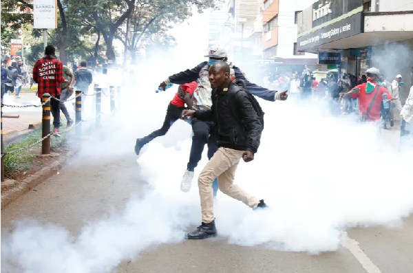 Police use tear gas to disperse protesters during a demonstration against  tax hikes in Nairobi