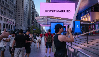 'Swifties', Taylor Swift fans, take photos outside Madison Square Garden during wedding
