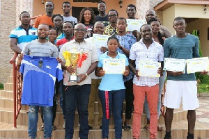 Players and officials of Akosombo Hydro Spikes with their trophy and certificates