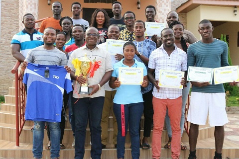 Players and officials of Akosombo Hydro Spikes with their trophy and certificates