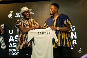 Ghana legend Asamoah Gyan with coach J.E.A Sarpong