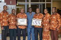 Golden Bean Hotel executives with their award