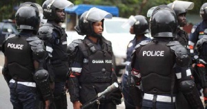 File photo of police men in anti-riot security gear