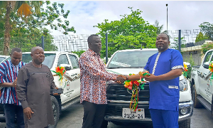 Mr Ignatius Bafour Awuah presenting the pickups on behalf of government