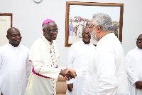 Archbishop Kwofie shaking hands with ex-president JJ Rawlings