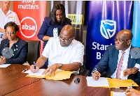 CEO of Stanbic Bank Ghana, Kwamina Asomaning and CEO of E&P, Ibrahim Mahama during the signing