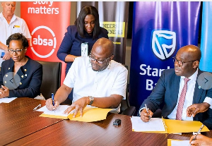 CEO of Stanbic Bank Ghana, Kwamina Asomaning and CEO of E&P, Ibrahim Mahama during the signing