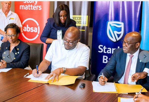 CEO of Stanbic Bank Ghana, Kwamina Asomaning and CEO of E&P, Ibrahim Mahama during the signing