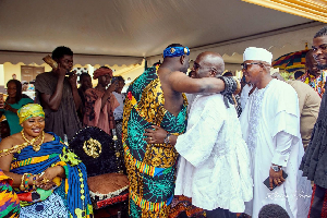 Julius Debrah (in white) greeting members of the Shai Traditional Council at the event