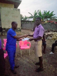 A student receiving his donation