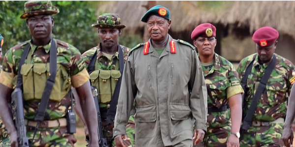 President Museveni (C) came to power as a rebel leader and is serving his sixth term in office