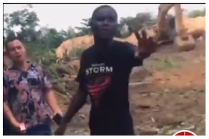 A youth at Akoase confronting a Chinese national
