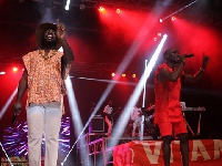 Kwabena Kwabena and Manifest performing  on stage