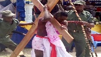 District Chief Executive of Birim South, Richmond Amponsah Adjabeng carrying the cross of Jesus