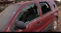 One of the cars that was destroyed by the armed men