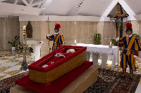 Pope Francis lying in a casket