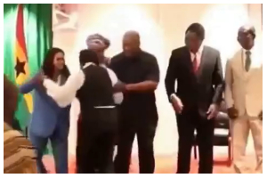 President Mahama (M) helped the woman to regain balance President Mahama (M) helped the woman to regain balance