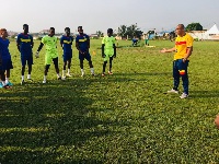 Kim Grant with Hearts of Oak players at training